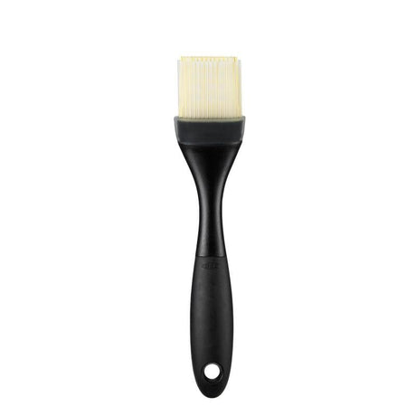 Silicone pastry brush with layered bristles for sauces and glazes, heat-resistant, ergonomic, and dishwasher safe.