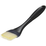 Heat-resistant silicone basting brush with tapered bristles, odor-resistant, and easy to clean for effortless flavor application.