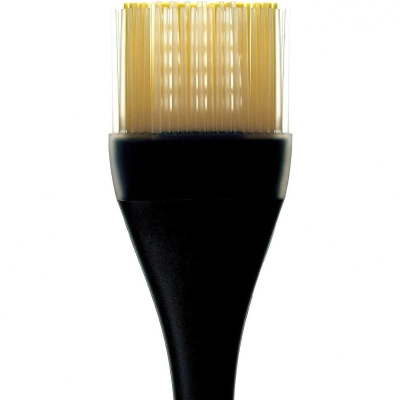 Heat-resistant silicone basting brush with tapered bristles for even sauce application and easy cleanup.