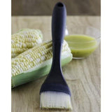 Silicone basting brush features heat-resistant bristles, angled head, and easy-clean design for flavorful cooking.