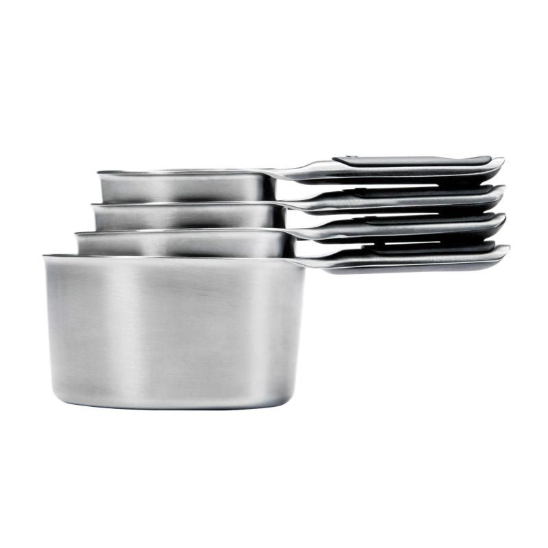 Stainless steel measuring cup set with magnetic handles, featuring etched measurements and non-slip grips for precise measuring.