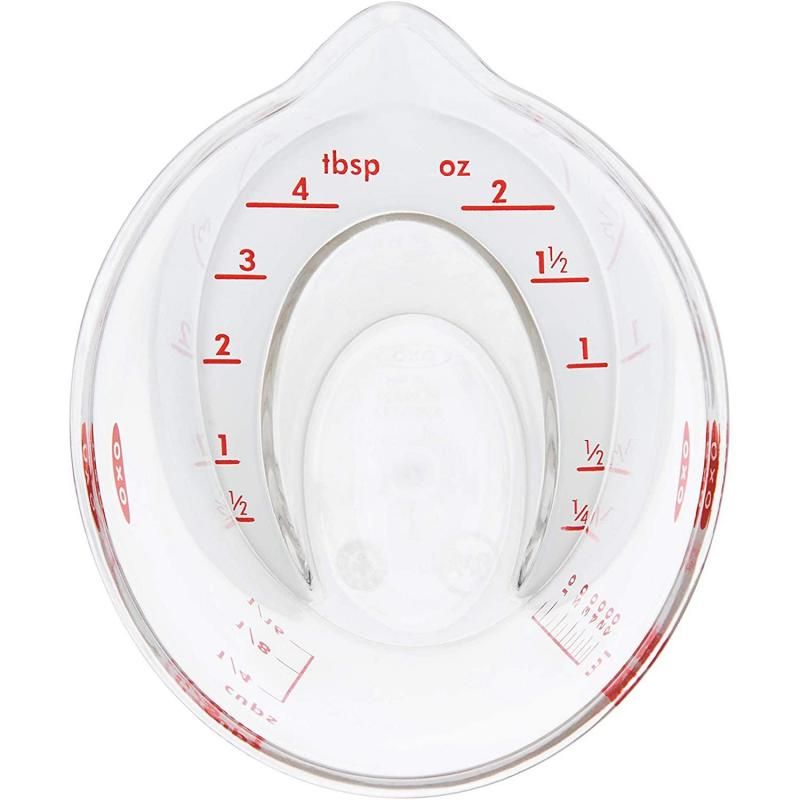 Mini OXO Good Grips Angled Measuring Cup with easy-to-read markings for precise liquid and dry ingredient measurements.