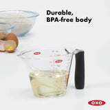 OXO Good Grips Angled Measure Cup with clear measurement markings, non-slip handle, and spill-proof spout, ideal for precise measuring.