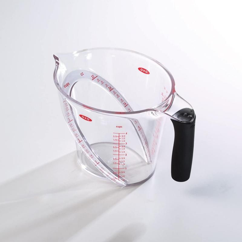 Angled measuring cup with clear markings for easy reading, ergonomic handle, ideal for accurate liquid measurement in cooking.