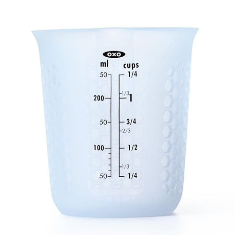 Silicone measuring cup with honeycombed design, ideal for hot liquids, easy-squeeze pour spout, 1 cup capacity.