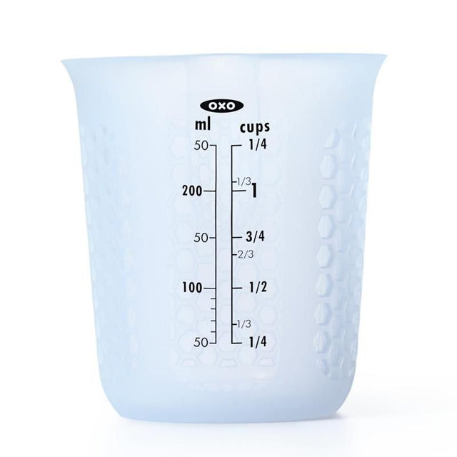 Silicone measuring cup with honeycombed design, ideal for hot liquids, easy-squeeze pour spout, 1 cup capacity.