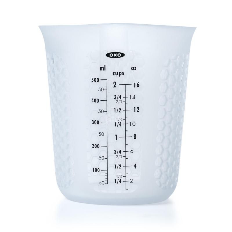 OXO Good Grip Squeeze & Pour Measuring Cup in silicone, features a narrow spout, measurement markings, and heat-dissipating grip.