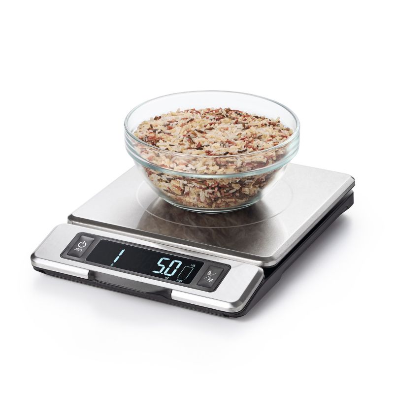 OXO stainless steel food scale with pull-out display, measures up to 11 lb/5 kg, perfect for precise ingredient weighing.