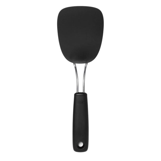 Nylon flexible turner for easy flipping of delicate foods, with heat resistance, ergonomic handle, and dishwasher-safe design.