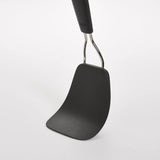 Nylon flexible turner for delicate foods, with ergonomic handle and heat-resistant design; perfect for nonstick cookware.