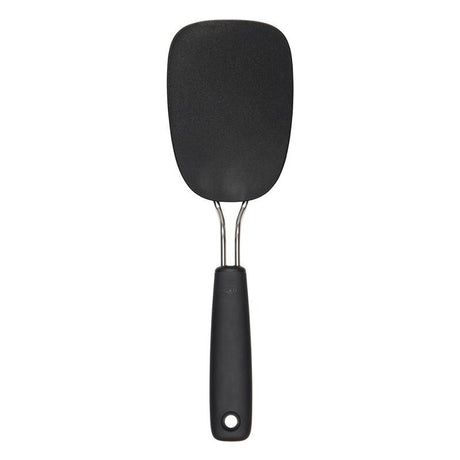 Large nylon flexible turner with a comfortable grip, heat-resistant up to 400°F, ideal for flipping delicate foods.