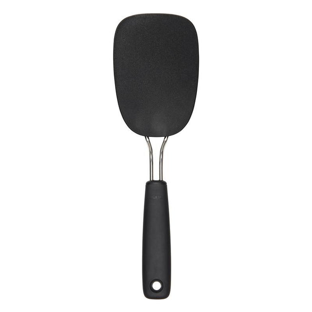 Large nylon flexible turner with a comfortable grip, heat-resistant up to 400°F, ideal for flipping delicate foods.