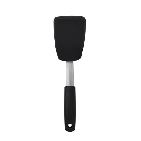 Small silicone flexible turner with stainless steel core; ideal for flipping eggs and pancakes in non-stick cookware.