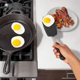 Small silicone flexible turner from OXO with a comfortable grip, ideal for flipping delicate foods without damage.