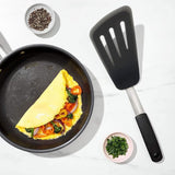 OXO Good Grips Silicone Flexible Omelette Turner for flipping delicate dishes with a high-heat resistant, non-stick safe design.