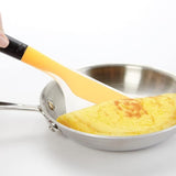 Large OXO Good Grips omelet turner with a flexible head and non-slip handle, perfect for flipping omelets and quesadillas.