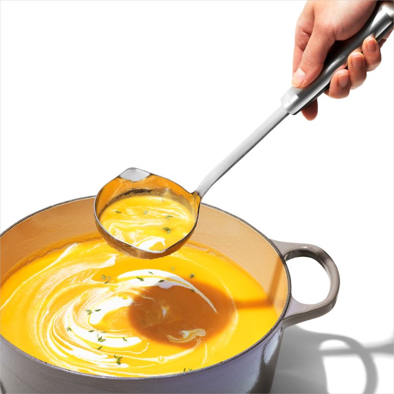 Stainless steel ladle with angled head and dual pour spouts for precise serving of soups and stews, featuring a non-slip grip.