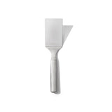 Stainless steel OXO Lasagna Turner with angled, flexible head for effortless serving of lasagna, quiche, and more.