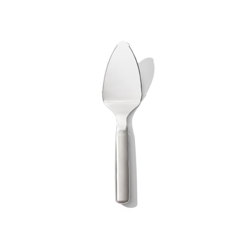 Sleek OXO Steel Pie Server with serrated edges, perfect for cutting and serving pies, cakes, and quiches effortlessly.