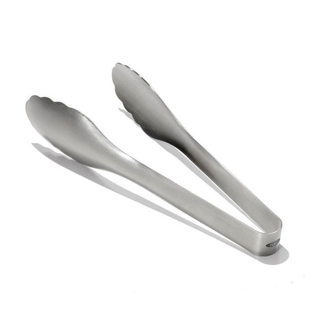 Sleek stainless steel serving tongs with scalloped heads for enhanced grip, ideal for tossing and serving various dishes.