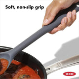 OXO Good Grips Silicone Spoon with soft grip, high heat resistance, perfect for stirring and scraping without scratching cookware.