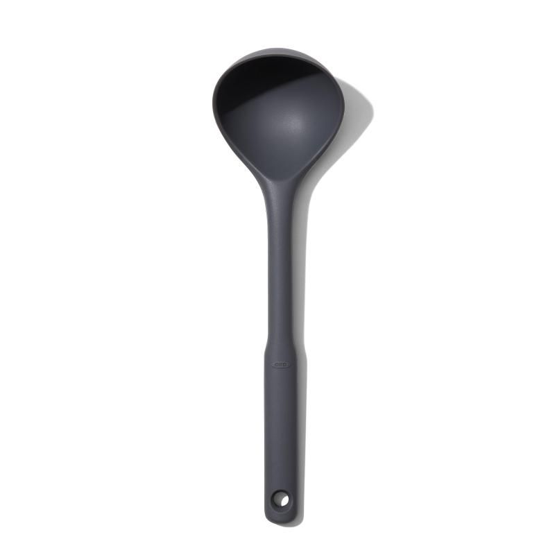 Flexible OXO Good Grips Silicone Ladle with non-slip handle, angled design for drip-free serving and safe for non-stick cookware.