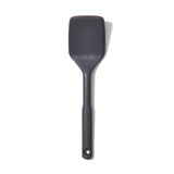 Versatile OXO Good Grips Silicone Turner with heat-resistant silicone, beveled edges, and ergonomic handle for effortless flipping.