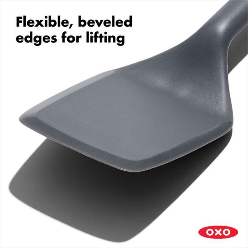 Versatile OXO Good Grips Silicone Turner with flexible edges, heat-resistant silicone, and non-slip grip for easy cooking.