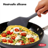 Versatile OXO Good Grips Silicone Turner with heat-resistant silicone, beveled edges, and non-slip grip for easy flipping and lifting.