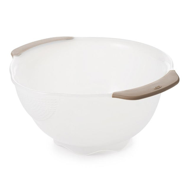 OXO Rice & Grain Washing Colander with small holes, pour spout, and non-slip handles for washing grains and berries effortlessly.