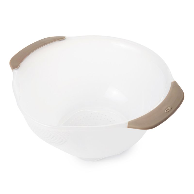 OXO Rice & Grain Washing Colander with unique holes for perfect drainage, non-slip handles, and ideal for rinsing small grains and berries.