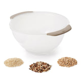 OXO Rice & Grain Washing Colander with unique holes for draining water, preventing grain loss, and ensuring cleanliness.