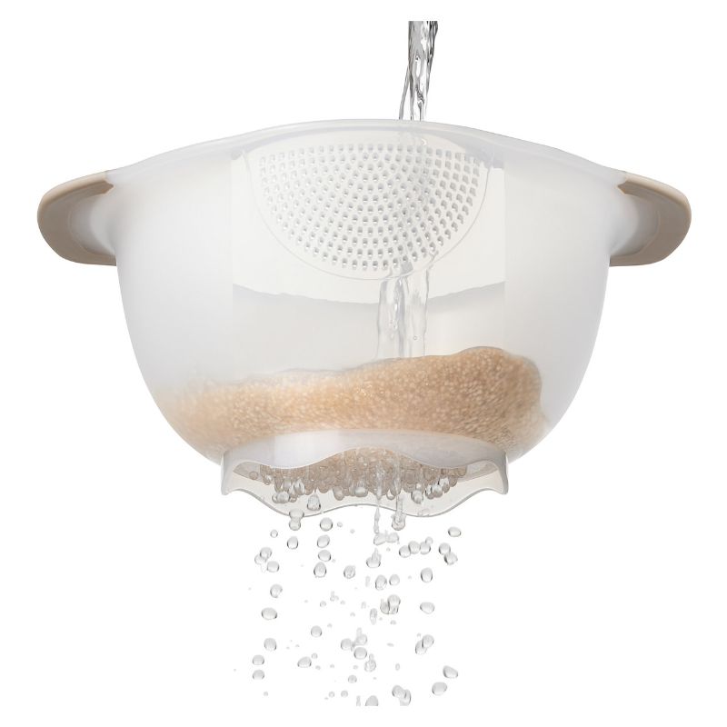 OXO Rice & Grain Washing Colander with small holes for effective washing, featuring a pour spout and comfortable non-slip handles.