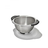 Stainless steel colander with non-slip handles, ideal for straining pasta and rinsing vegetables, featuring five sturdy feet.