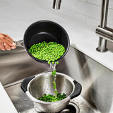 OXO Good Grips Stainless Steel Colander with non-slip handles, perfect for rinsing, straining, and draining food.