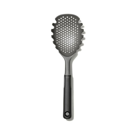 OXO Good Grips Pasta Scoop Strainer with ergonomic handle for easy scooping and straining of pasta, veggies, and poached eggs.