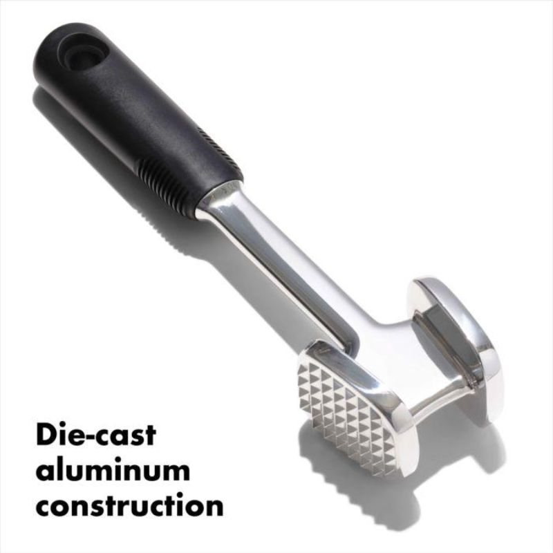 OXO Good Grips Die Cast Meat Tenderizer with dual-sided design for tenderizing and flattening meat, featuring a non-slip grip.