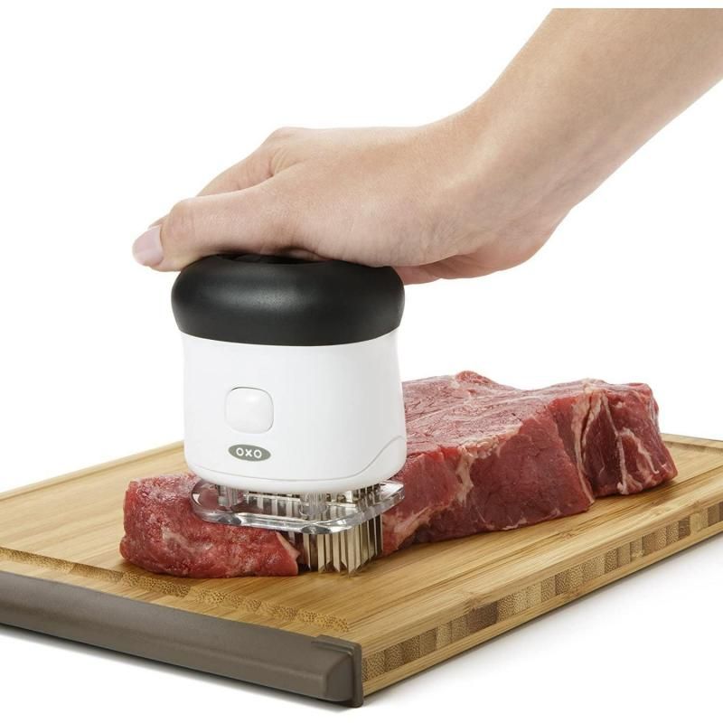 OXO Good Grips Bladed Meat Tenderizer with 50 stainless steel blades for tenderizing meat and enhancing flavor absorption.