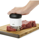 OXO Good Grips Bladed Meat Tenderizer with 50 stainless steel blades for tenderizing meat and enhancing flavor absorption.