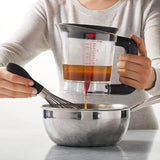 OXO Good Grips 4-cup gravy fat separator with silicone shut-off valve and non-slip handle for healthier sauces.