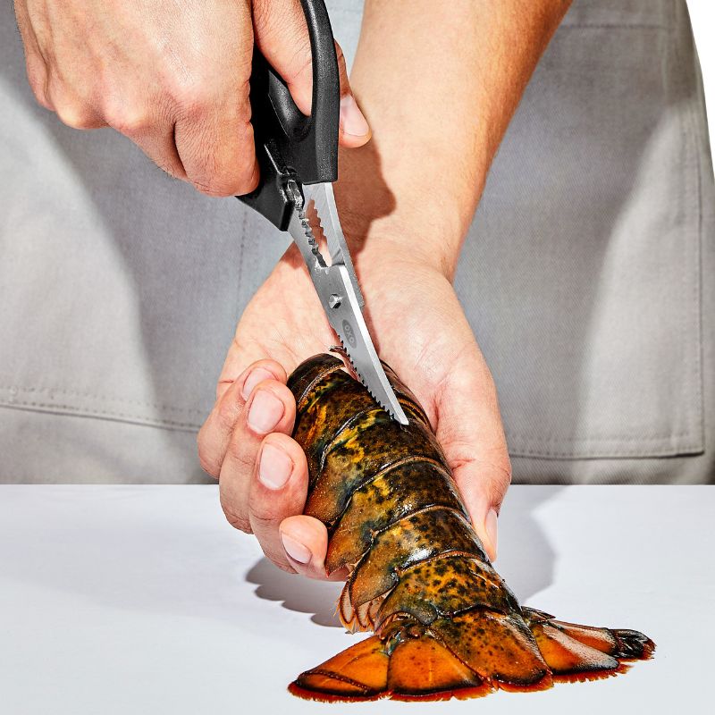 OXO Good Grips Seafood Scissors with curved stainless steel blades and non-slip handles for easy seafood preparation.