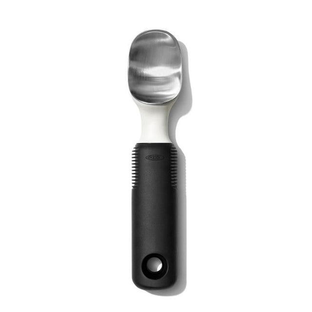 Durable stainless steel ice cream scoop with pointed tip, flat edges, and ergonomic non-slip grip for effortless serving.