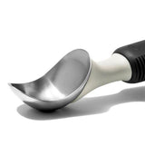 Ergonomic stainless steel ice cream scoop with pointed tip and flat edges for easy serving and minimal waste.