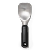 Ergonomic OXO Good Grips Ice Cream Spade with a wide stainless steel head for easy scooping and spreading of desserts.