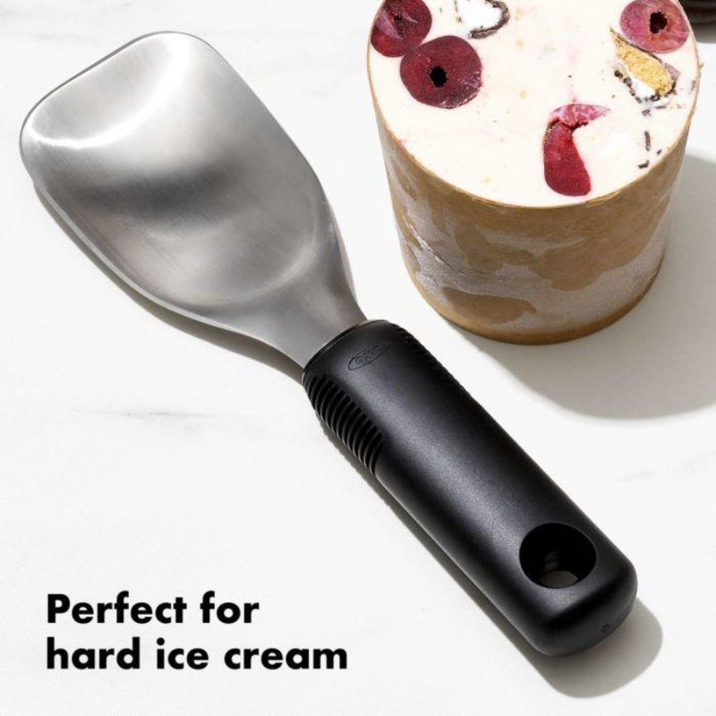 Ergonomic OXO Good Grips Ice Cream Spade with wide stainless steel head for effortless scooping and spreading frozen desserts.