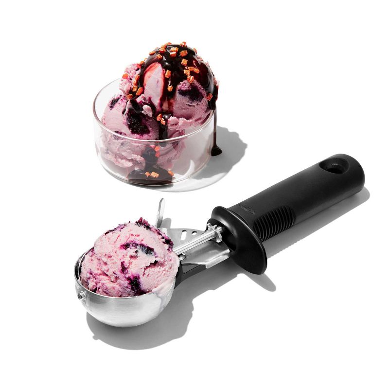 OXO Trigger Ice Cream Scoop featuring a swing trigger for effortless, large scoops with a non-slip handle and finger guard for safety.