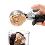 OXO Trigger Ice Cream Scoop with swing trigger, non-slip handle, and finger guard for easy, perfect scooping of frozen treats.