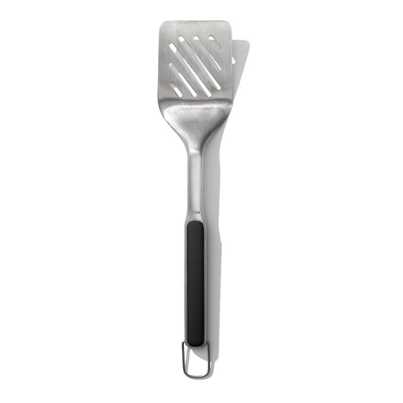 Stainless steel grilling turner with a wide head and non-slip grip for easy flipping of burgers and fish. Dishwasher safe.