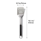 Durable OXO Good Grips Grilling Turner with wide beveled head, non-slip grip, and double-bend design for easy food flipping.