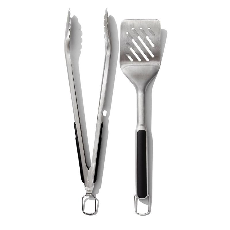 OXO Good Grips Grilling Tongs and Turner Set featuring stainless steel, non-slip grips, and built-in bottle opener for easy grilling.